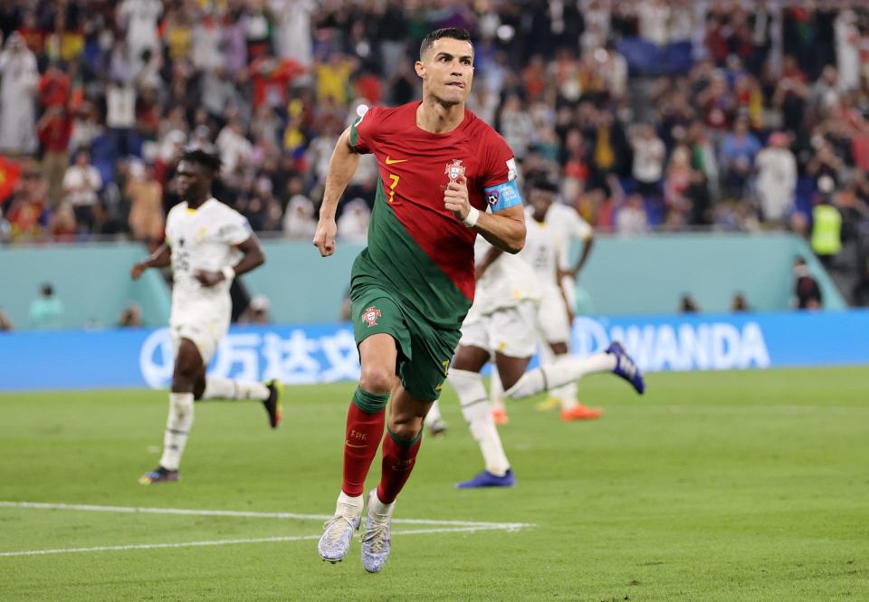 Cristiano Ronaldo of Portugal celebrates after scoring their team's first goal via a penalty during the FIFA World Cup Qatar 2022 Group H match between Portugal and Ghana at Stadium 974.