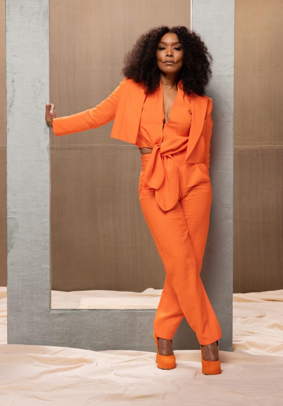 A woman in an orange suit