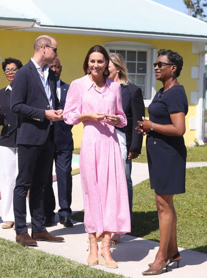 Kate Middleton wears a pink printed Rixo Izzy shirtdress and Castañer suede wedge espadrilles in The Bahamas on March 26, 2022. - Credit: MEGA