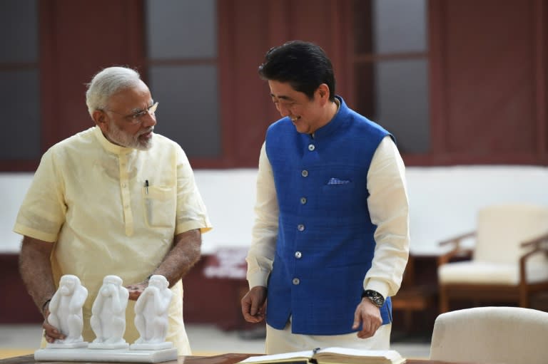 Japanese Prime Minister Shinzo Abe (right) and Indian Prime Minister Narendra Modi visit Sabarmati Ashram in Ahmedabad, on September 13, 2017