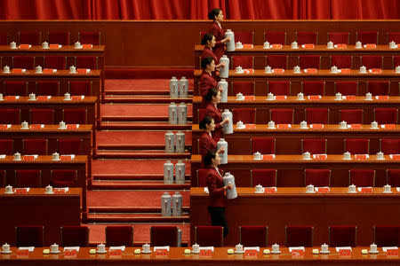 Attendants prepare tea inside the Great Hall of the People before the opening of the 19th National Congress of the Communist Party of China at the Great Hall of the People in Beijing, China October 18, 2017. REUTERS/Jason Lee