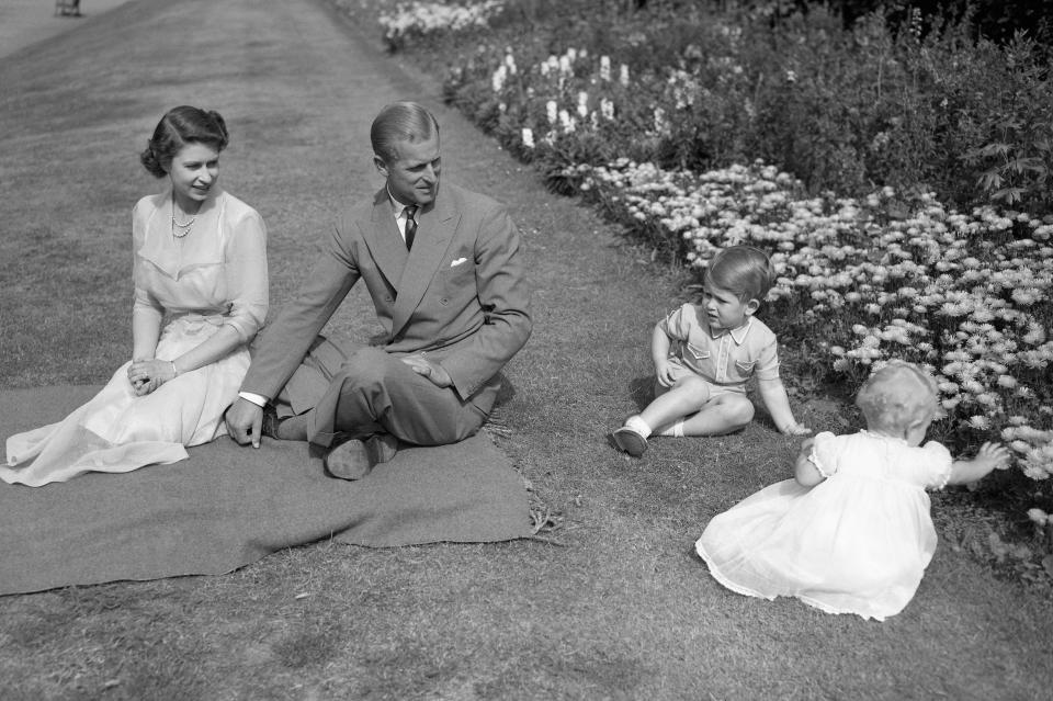 Queen Elizabeth, Prince Philip, Prince Charles, and Princess Anne at Clarence House in 1951.