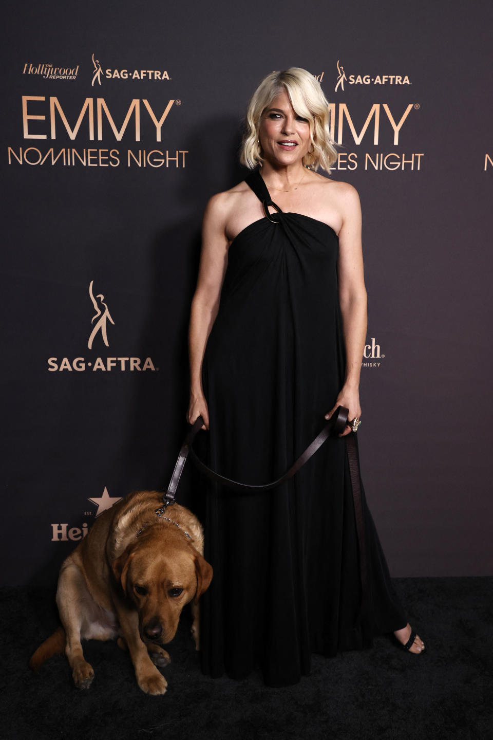 Blair brought her service dog, Scout, to the event as she lives with her multiple sclerosis (MS) in remission. (Photo by Michael TRAN / AFP) (Photo by MICHAEL TRAN/AFP via Getty Images)