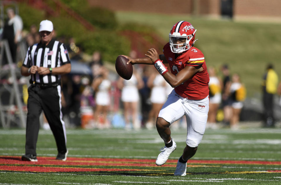 Maryland quarterback Taulia Tagovailoa scambles against Towson in the first half of an NCAA college football game Saturday, Sept. 2, 2023, in College Park, Md. (AP Photo/Steve Ruark)
