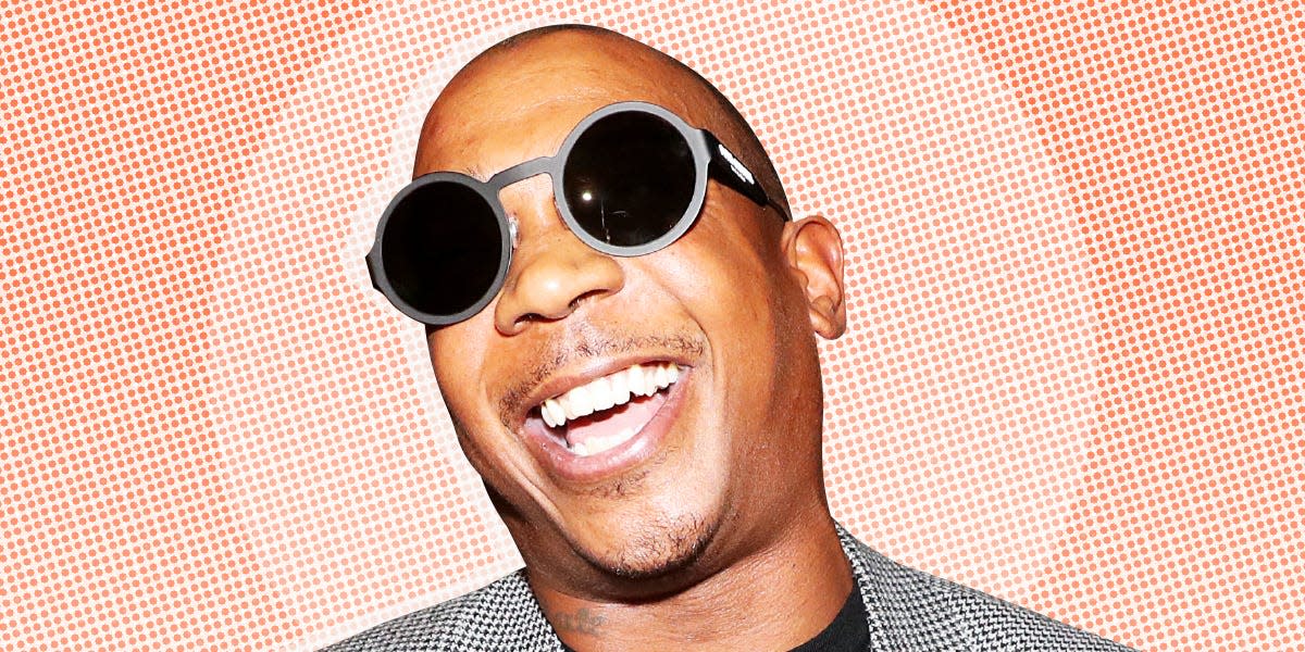 Ja Rule, an American rapper on a light orange patterned background