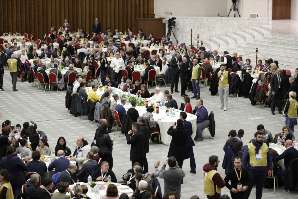 Pope Francis sits at a table during a lunch, at the Vatican, Sunday, Nov. 18, 2018. Pope Francis is offering several hundred poor people, homeless, migrants, unemployed a lunch on Sunday as he celebrates the World Day of the Poor with a concrete gesture of charity in the spirit of his namesake, St. Francis of Assisi.(AP Photo/Andrew Medichini)