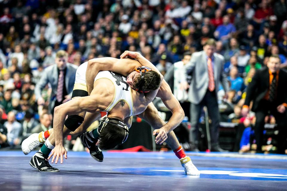 Princeton's Pat Glory, top, wrestles Purdue's Matt Ramos at 125 pounds in the finals during the sixth session of the NCAA Division I Wrestling Championships, Saturday, March 18, 2023, at BOK Center in Tulsa, Okla.