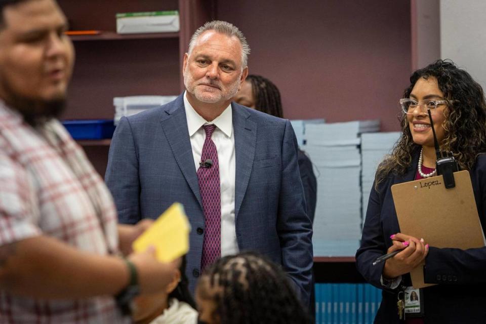 Lauderdale Lakes, Florida, August 21, 2023 - Broward Schools Superintendent Peter Licata, center, and Lauderdale Lakes Middle School’s principal Linda Lopez, right, listen to teacher Adair Dominguez, left, as he talks to his students during a visit on the first day of school in Broward County. BROWARD COUNTY, August 21, 2023 - Superintendent Peter Licata around for the first day of school in Broward. We{ll go to three schools in the morning and then the press conference at 3:30 p.m. 7:10 – 7:35 a.m. Monarch High School 5050 Wiles Road Coconut Creek, 33073 8:15 – 8:45 a.m. Broadview Elementary School 1800 S.W. 62nd Avenue North Lauderdale, 33068 9 – 9:30 a.m. Lauderdale Lakes Middle School 3911 N.W. 30th Avenue Lauderdale Lakes, 33309 3:30 p.m. First Day of School News Conference Kathleen C. Wright Administration Center 600 S.E. Third Avenue Fort Lauderdale, 33301