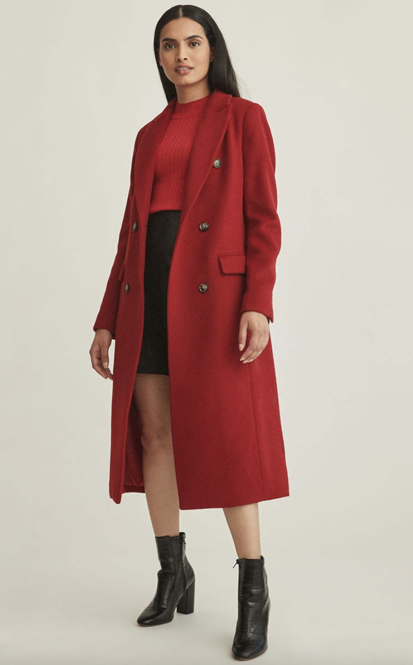 model in black boots, black mini skirt and red Long Double-Breasted Belted Wool Coat (Photo via RW&CO)