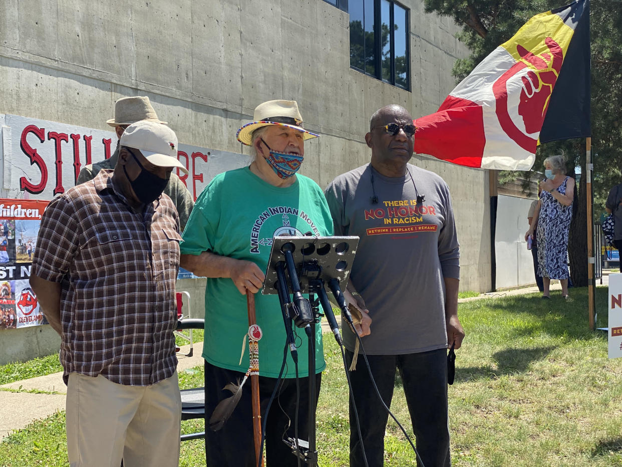 Clyde Bellecourt (center) addresses the media after the Washington football team retires its name on July 13, 2020 at the Minneapolis American Indian Center.