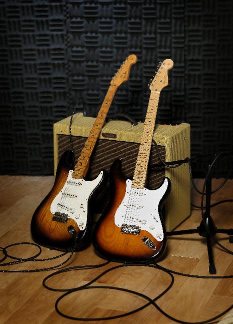 An original 1954 Fender Stratocaster, left, is shown next to a 2014 model at a studio in Scottsdale, Ariz. on Friday, Jan. 10, 2014. Leo Fender developed the instrument in a small workshop in Fullerton, Calif. six decades ago. (AP Photo/Matt York)
