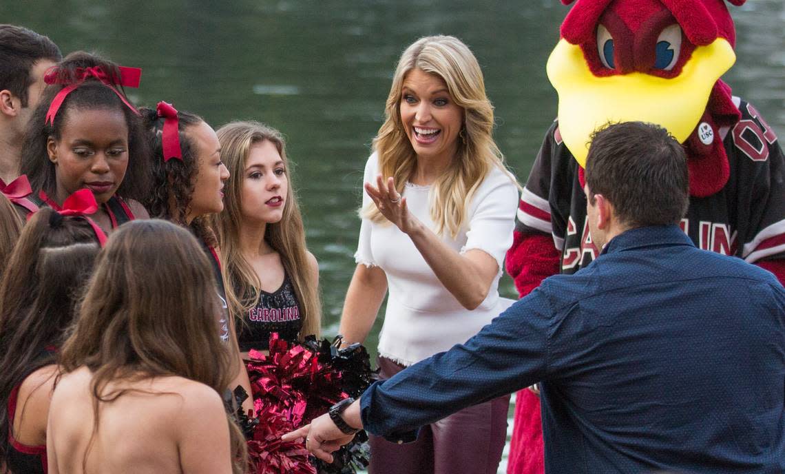 In this file photo, Ainsley Earhardt, co-host of “Fox & Friends” and USC alum, waves to a USC student while broadcasting at Davis Field on the University of South Carolina campus in Columbia last April.