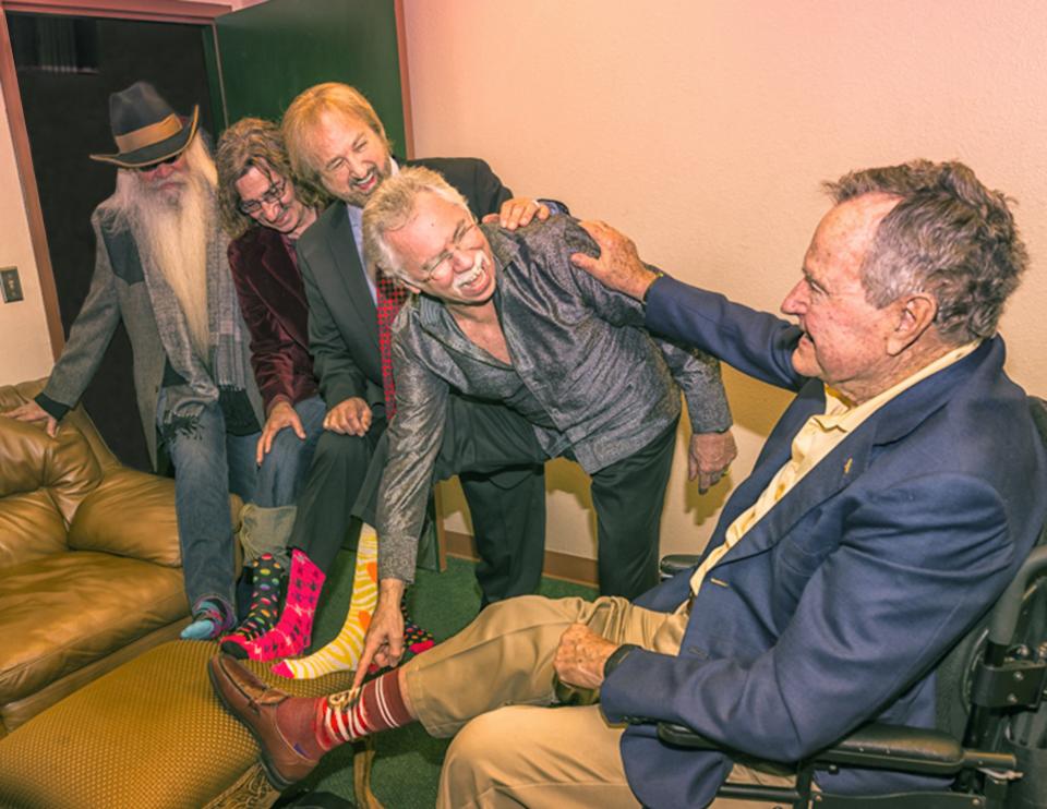 The Oak Ridge Boys compare colorful socks with former President George H. W. Bush.