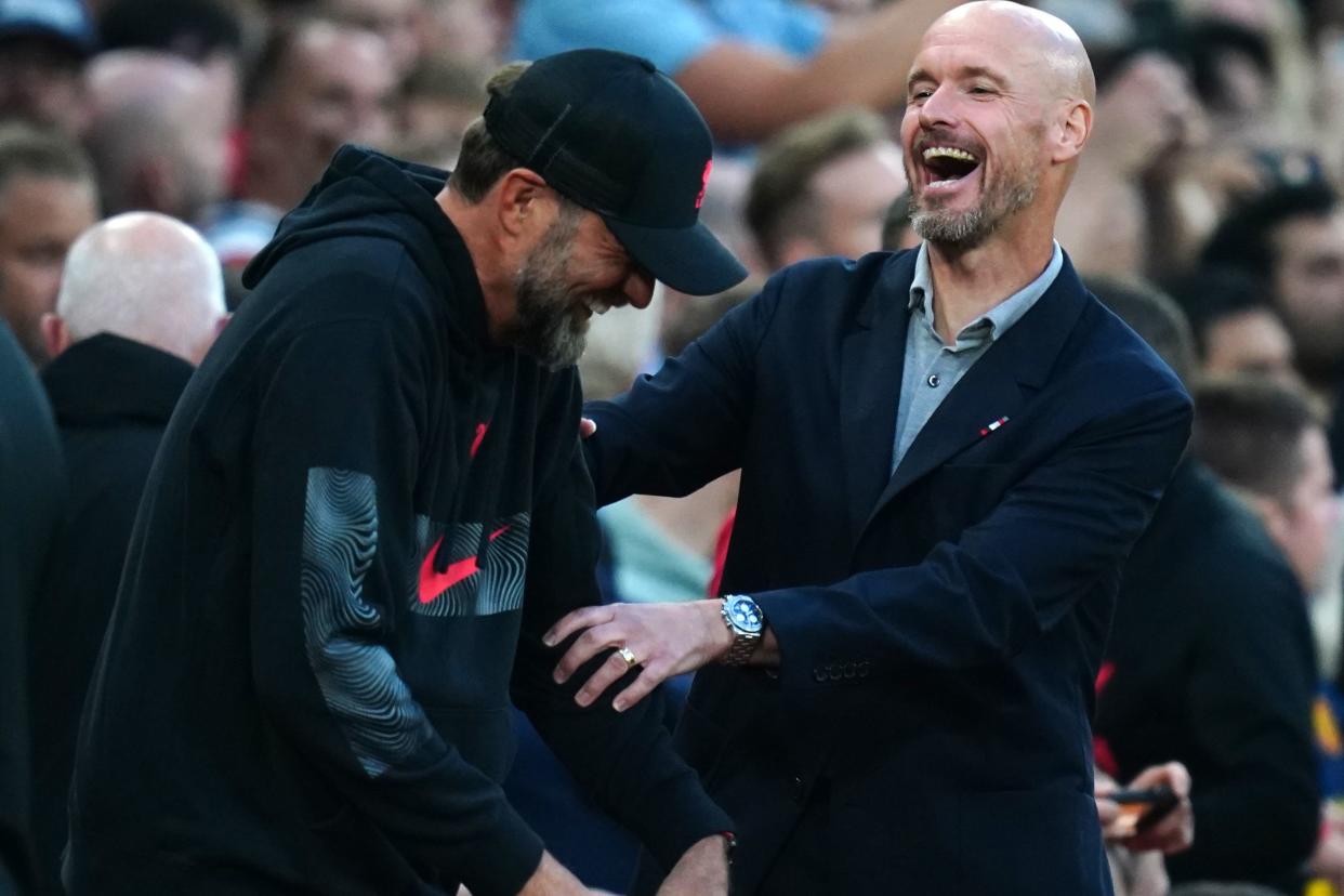 Klopp with Manchester United coach Erik ten Hag (right) (PA Archive)