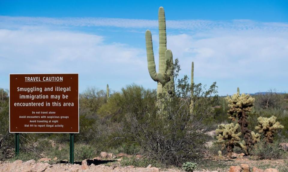 A sign warns against illegal smuggling and immigration near Lukeville, Arizona.