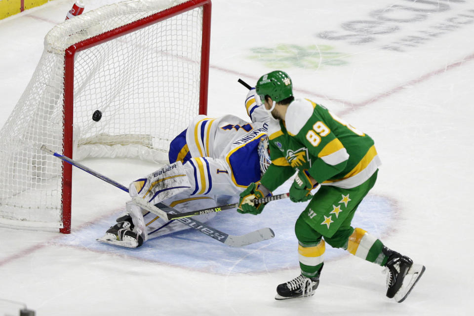 Minnesota Wild center Frederick Gaudreau (89) scores past Buffalo Sabres goaltender Ukko-Pekka Luukkonen (1) in the shootout of an NHL hockey game Saturday, Jan. 28, 2023, in St. Paul, Minn. (AP Photo/Andy Clayton-King)