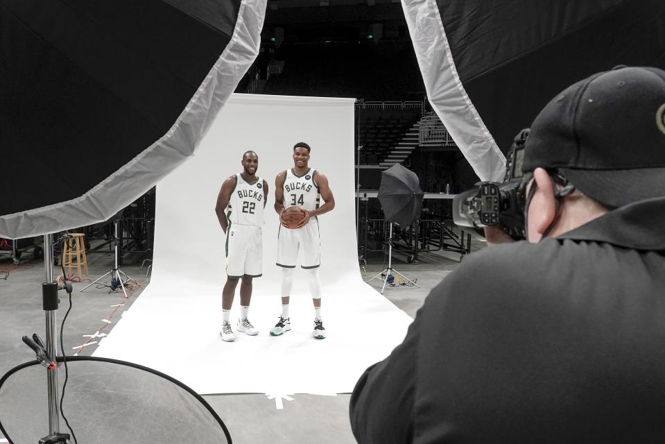 Milwaukee Bucks' Giannis Antetokounmpo and Khris Middleton pose for a picture during an NBA basketball media day Monday, Sept. 27, 2021, in Milwaukee. (AP Photo/Morry Gash)