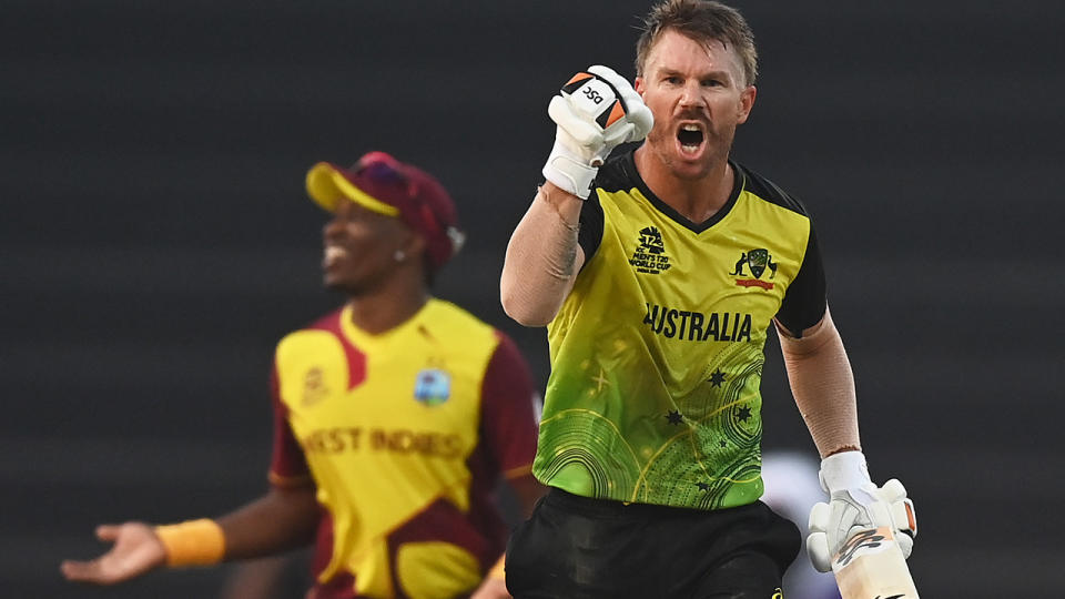 David Warner celebrates as Australia defeats the West Indies during the T20 World Cup group stage.