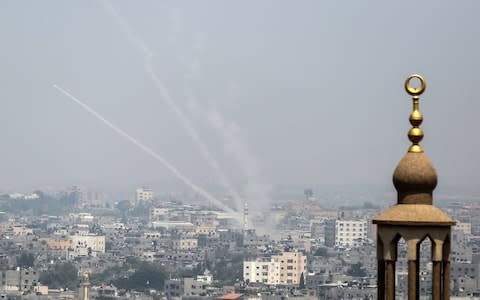 Palestinian rockets being fired from Gaza City towards Israel - Credit: STRINGER/AFP/Getty Images