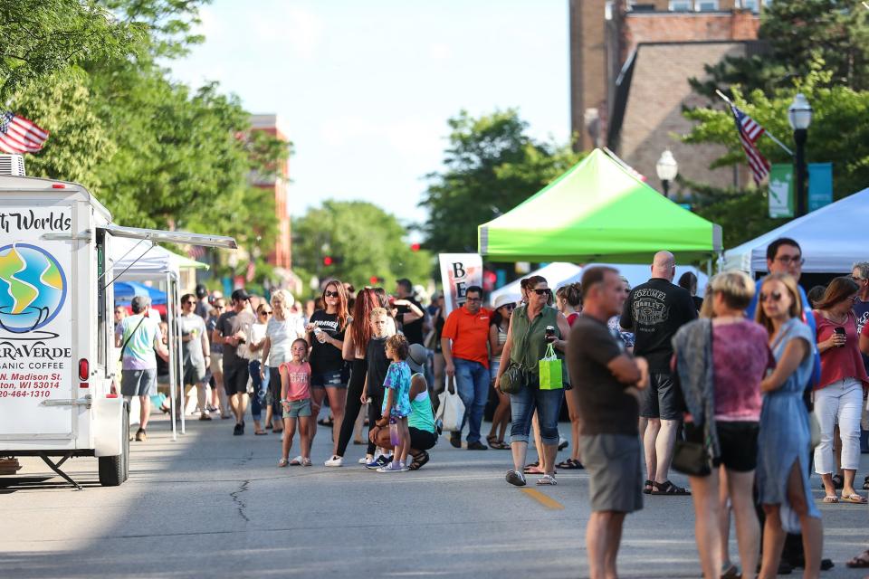 Dozens of people gather and shop during the 2021 Night Market on Main Street in Fond du Lac.