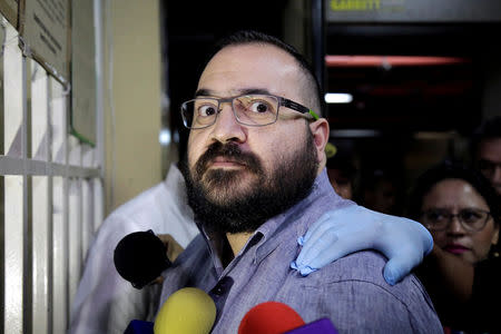 FILE PHOTO: Javier Duarte, former governor of Mexican state of Veracruz, reacts while arriving for a court appearance for extradition proceedings in Guatemala City, Guatemala July 4, 2017. REUTERS/Luis Echeverria/File Photo