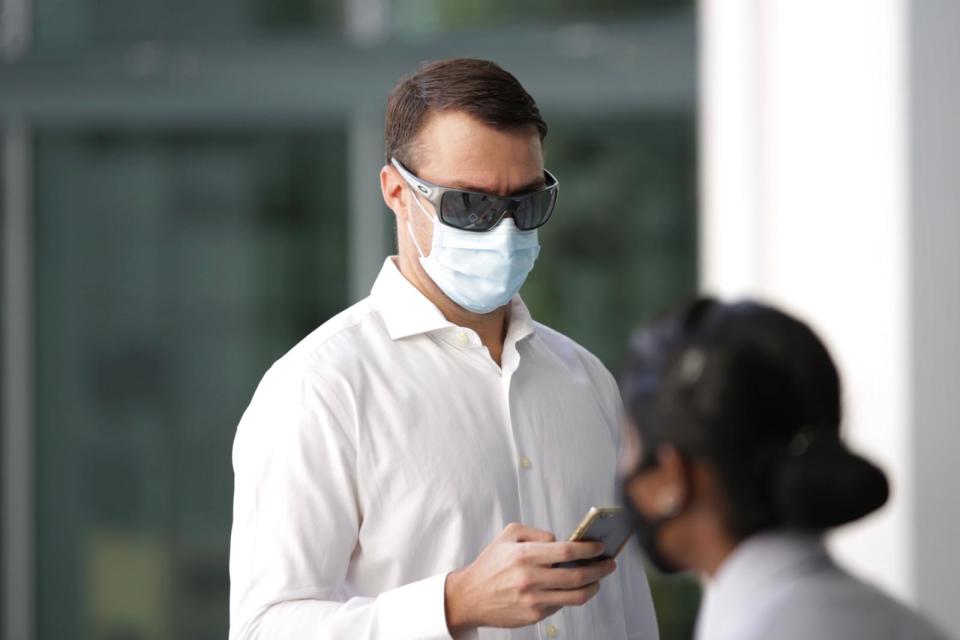 Perry Scott walking into State Courts on 2 June. (PHOTOS: Dhany Osman / Yahoo News Singapore)