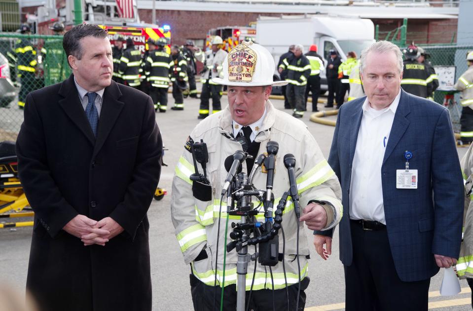 From left, Brockton Mayor Robert Sullivan, Brockton Fire Chief Brian Nardelli and Signature Healthcare President and CEO Robert Haffey address the media in the aftermath of the 10-alarm fire that started in the morning at the hospital on Tuesday, Feb. 7, 2023.