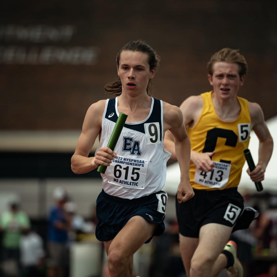 Corning's Jack Gregorski comes up from behind on East Aurora's Evan Owens in the boys 3,200-meter run at the 2022 NYSPHSAA Outdoor Track and Field Championships in Syracuse on Saturday, June 11, 2022. Corning took first in 7:49.70 and East Aurora was second in 7:50.88.