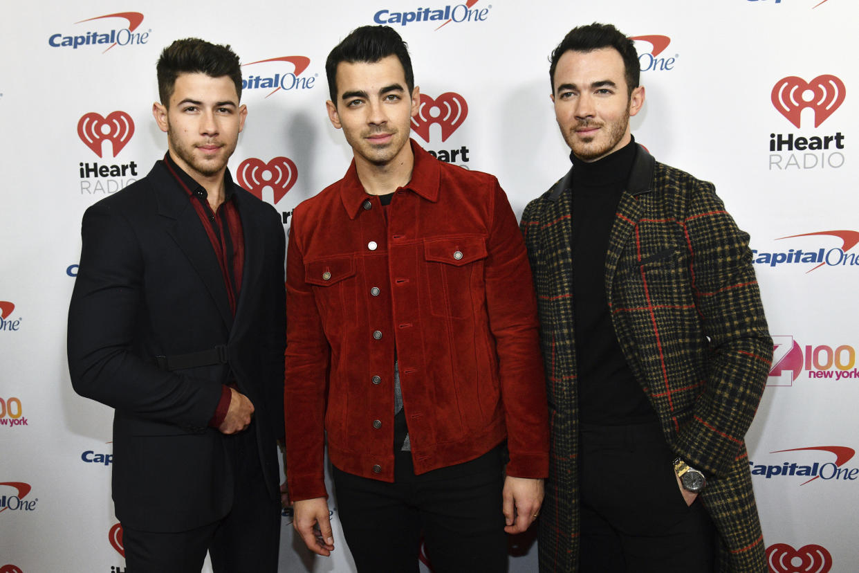 Nick Jonas, Joe Jonas and Kevin Jonas attend Z100's iHeartRadio Jingle Ball in New York City. (Photo: Charles Sykes/Invision/AP)