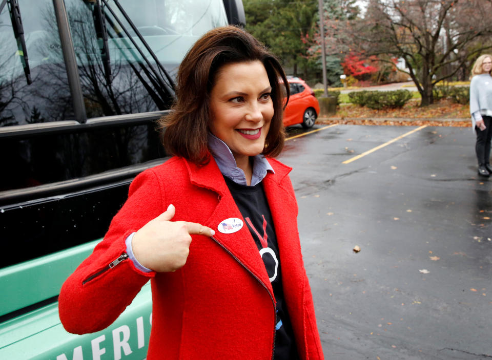 Michigan Democratic gubernatorial candidate Gretchen Whitmer points to her I Voted sticker during an interview in front of her bus after voting in the midterm election at her polling station at the St. Paul Lutheran Church in East Lansing, Michigan, U.S. November 6, 2018. REUTERS/Jeff Kowalsky
