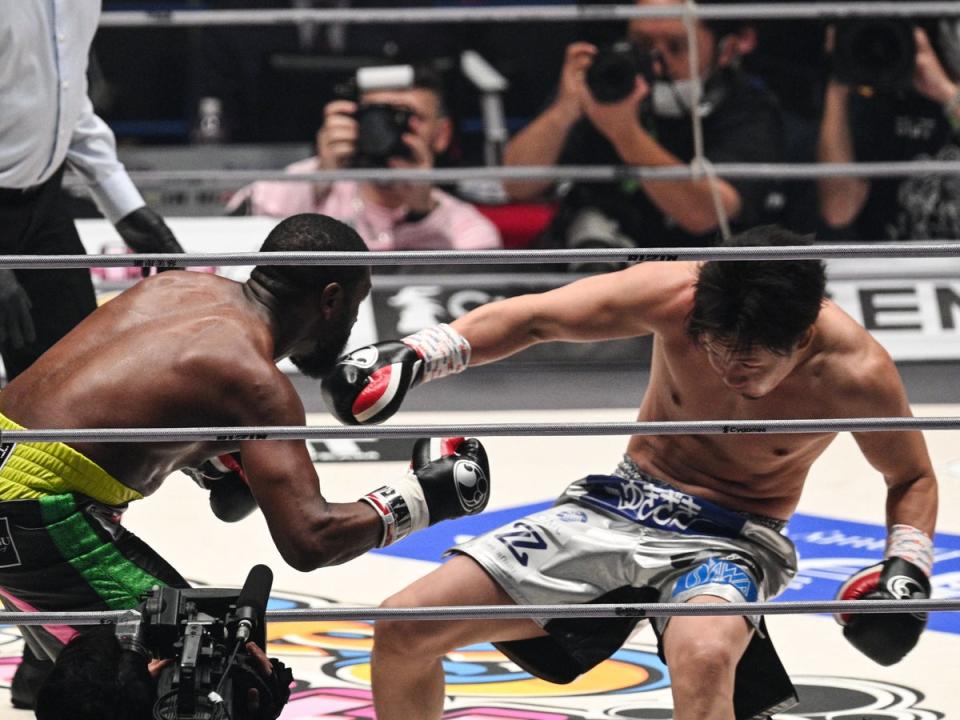 Mayweather drops Asakura with the final punch of the second round (AFP via Getty Images)