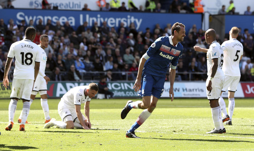 Stoke City’s Peter Crouch, centre right, celebrates scoring his side’s second goal of the game during the English Premier League soccer match between Swansea City and Stoke City, at the Liberty Stadium, in Swansea, Wales, Sunday May 13, 2018. (David Davies/PA via AP)