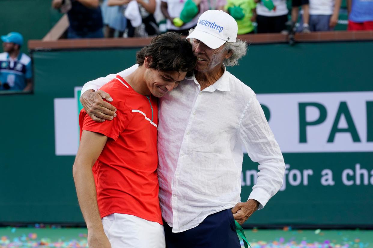 Taylor Fritz is hugged by his father, Guy Fritz, after defeating Rafael Nadal in the men's singles finals at the BNP Paribas Open tennis tournament Sunday, March 20, 2022, in Indian Wells, Calif.