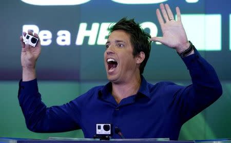GoPro Inc's founder and CEO Nick Woodman holds a GoPro camera as he celebrates GoPro Inc's IPO at the Nasdaq Market Site in New York City, June 26, 2014. REUTERS/Mike Segar