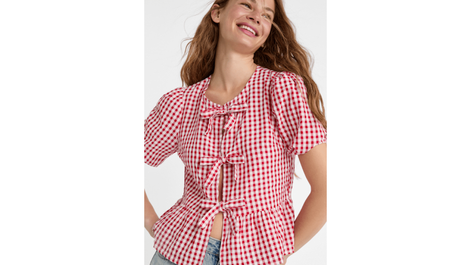 A model wearing a gingham top 