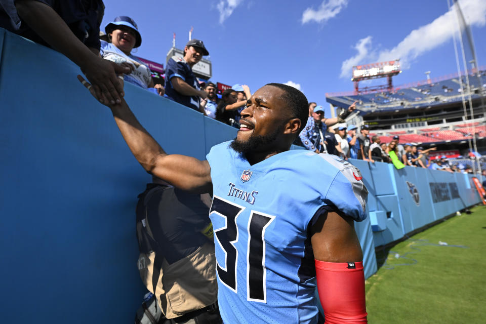 Tennessee Titans safety Kevin Byard shakes hands with a fan as he leaves the field after a 24-22 win against the Las Vegas Raiders in an NFL football game Sunday, Sept. 25, 2022, in Nashville, Tenn. (AP Photo/John Amis)