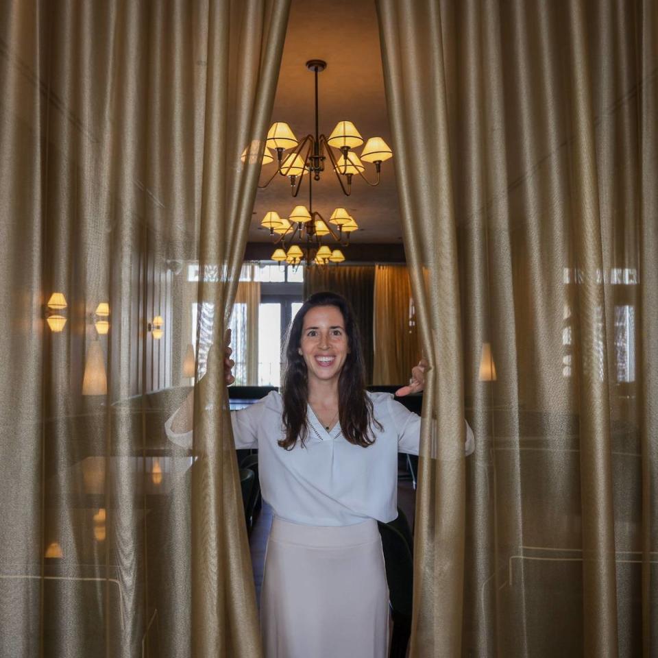 Marisa Galbut pulls back the luxurious curtain at the steakhouse inside the soon-to-open Gale Hotel and Residence during a rproperty preview on Thursday, May 16, 2024 in Miami, Florida.