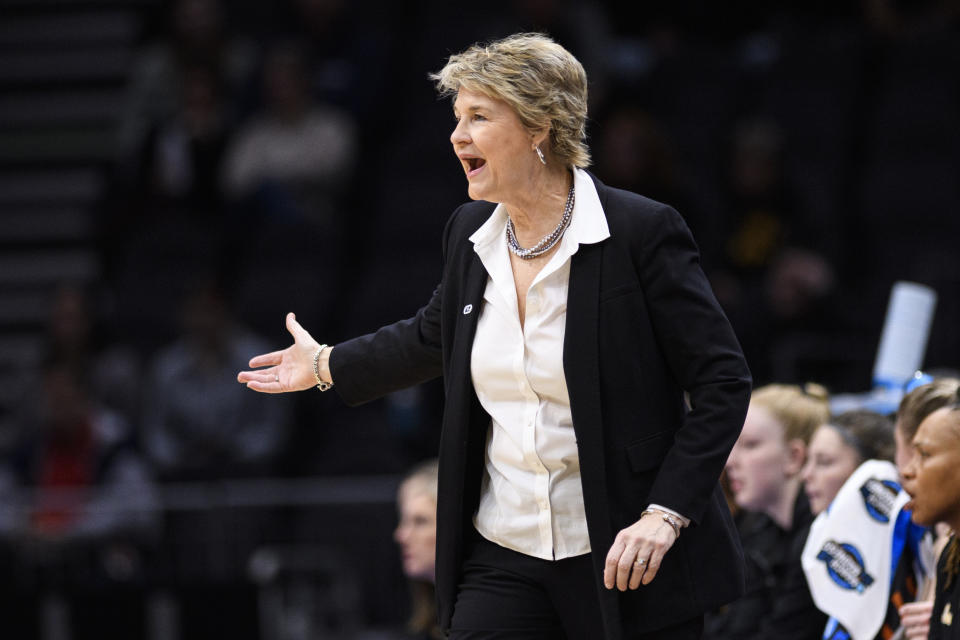 Iowa head coach Lisa Bluder directs her team in the first quarter of a Sweet 16 college basketball game against Colorado in the NCAA Tournament in Seattle, Friday, March 24, 2023. (AP Photo/Caean Couto)