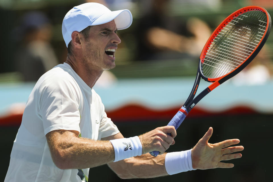 Britain's Andy Murray plays a forehand return to Australia's Alex de Minaur during their match at the Kooyong Classic in Melbourne, Australia, Thursday, Jan. 12, 2023. (AP Photo/Asanka Brendon Ratnayake)