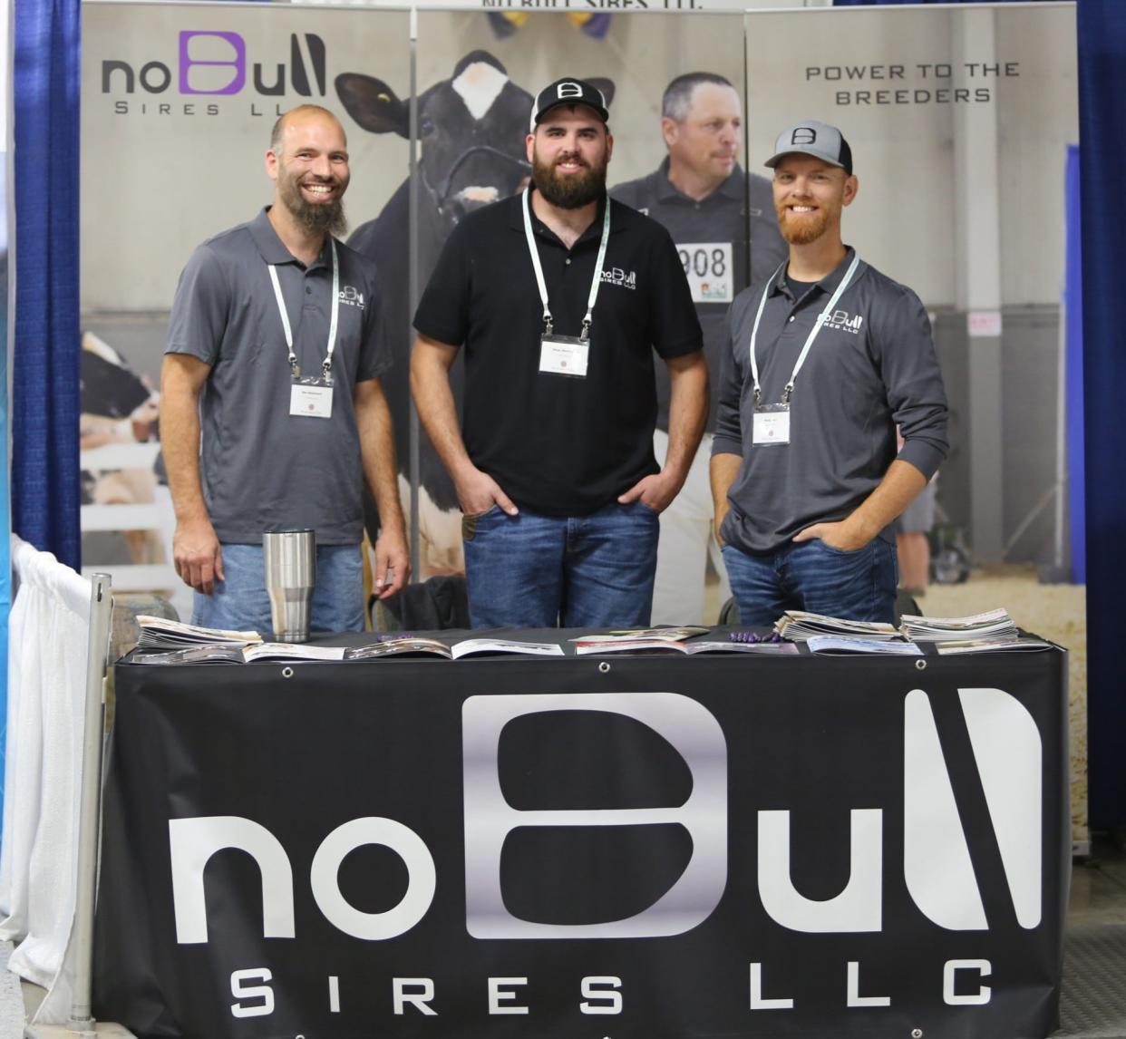 Ben Masemore, left, poses with Ethan Wentworth and Rusty Herr in front of the NoBull Sires logo. Wentworth and Herr have been jailed for practicing veterinary medicine without a license, which has become a cause among small farmers in central Pennsylvania.