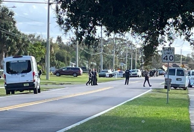 Law enforcement officers converged on a northeast Palm Bay neighborhood Sunday in an incident which left two officers injured and two people, including the suspected gunman, dead, police said.