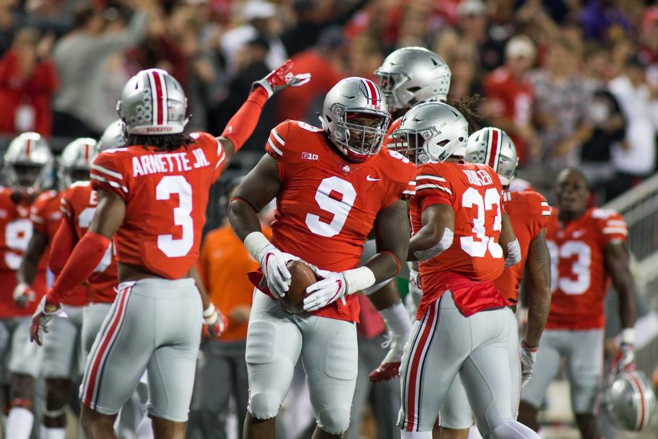 Ohio State defensive lineman Jashon Cornell (9) recovers the fumble in the first quarter against Oklahoma at Ohio Stadium, Sept. 9, 2017 in Columbus, Ohio.