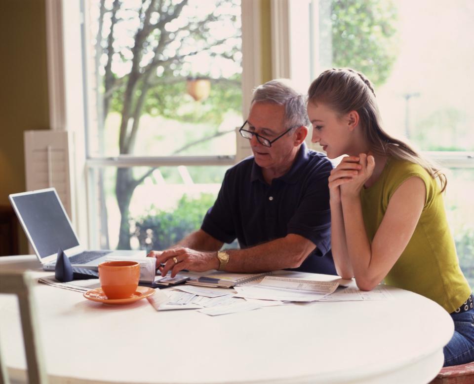 Father and daughter going over finances