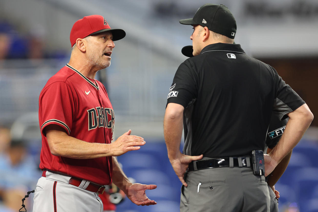 MIAMI, FLORIDA - MAY 04: Manager Torey Lovullo #17 of the Arizona Diamondbacks argues with umpires Dan Bellino #2 and Adrian Johnson #80 after Madison Bumgarner #40 (not pictured) was ejected from the game during the first inning against the Miami Marlins at loanDepot park on May 04, 2022 in Miami, Florida. (Photo by Michael Reaves/Getty Images)