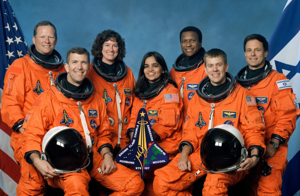 The crew of Space Shuttle Columbia's mission STS-107. Seated in front (L to R): Rick D. Husband, mission commander; Kalpana Chawla, mission specialist; and William C. McCool, pilot. Standing (L to R): David M. Brown, Laurel B. Clark, and Michael P. Anderson, all mission specialists; and Ilan Ramon, payload specialist representing the Israeli Space Agency. Columbia broke up over Texas during re-entry on February 1, 2003, killing all on board. / Credit: Getty Images / Getty Images