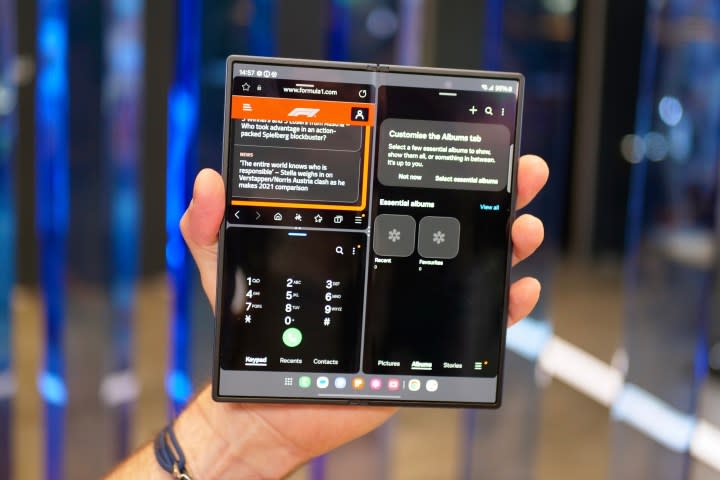 A person holding the open Samsung Galaxy Z Fold6, showing the screen.