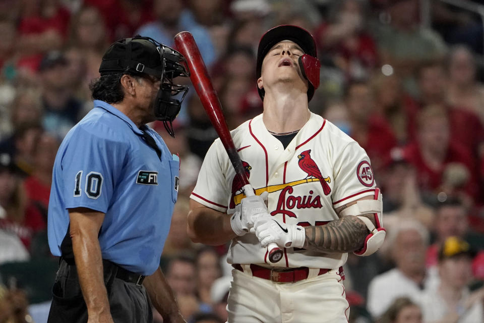 St. Louis Cardinals' Tyler O'Neill, right, reacts after being called out on strikes by home plate umpire Phil Cuzzi (10) during the fourth inning of a baseball game against the San Diego Padres Saturday, Sept. 18, 2021, in St. Louis. (AP Photo/Jeff Roberson)