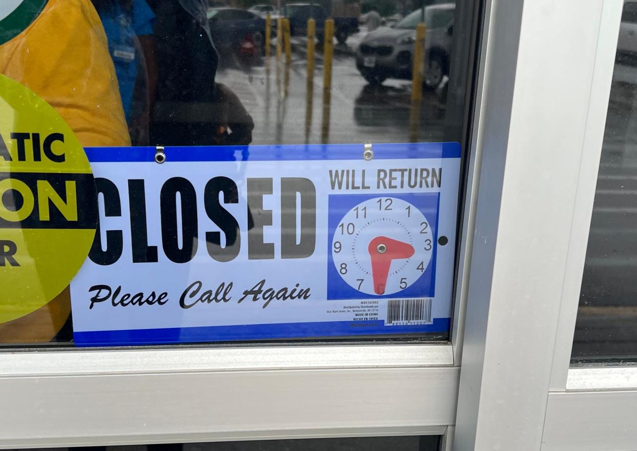 Closing sign outside of Flowood Walmart.