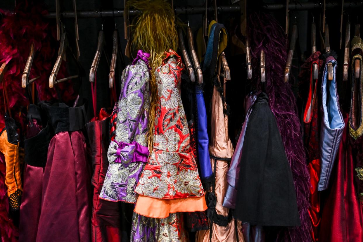 A rack of wardrobe pieces are positioned backstage before a performance of the musical "Moulin Rouge" on Wednesday, April 10, 2024, at the Wharton Center in East Lansing.