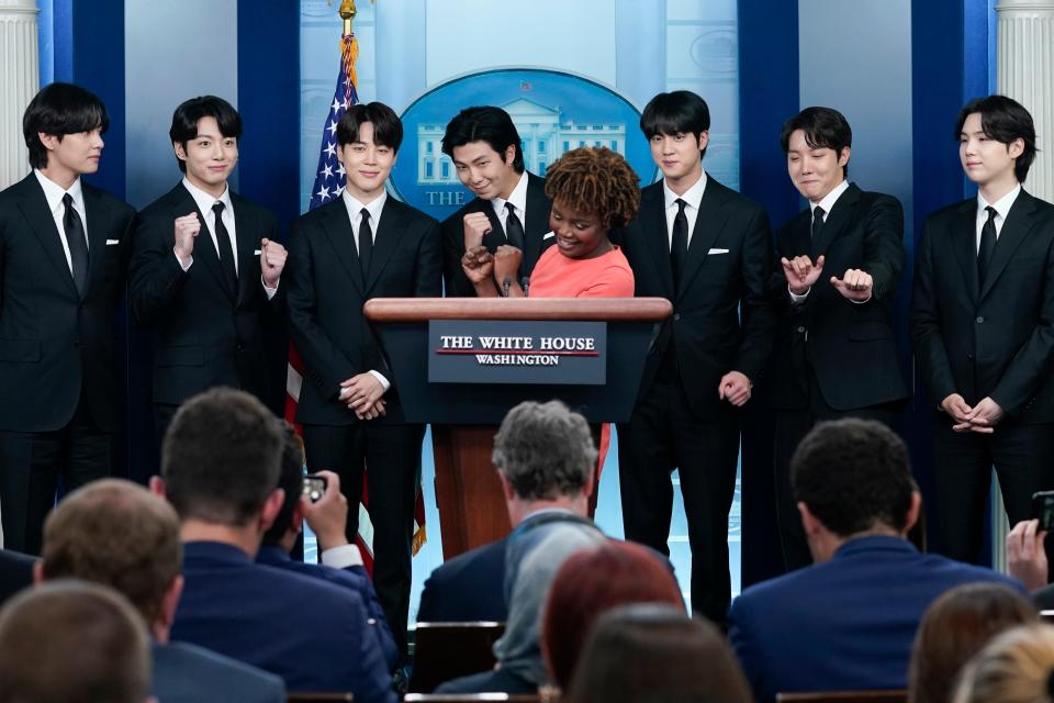 Members of BTS ( V (from left), Jungkook, Jimin, RM, Jin, J-Hope, and Suga) join White House press secretary Karine Jean-Pierre during the daily briefing at the White House May 31, 2022, in Washington D.C.